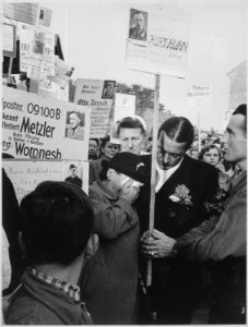 A returned German prisoner of war identified this woman's son. He will never return because he is dead. Prisoners... - NARA - 541970 photo