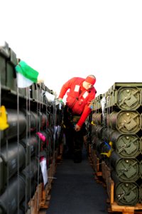 A Sailor checks ordnance at sea. (8249000935)