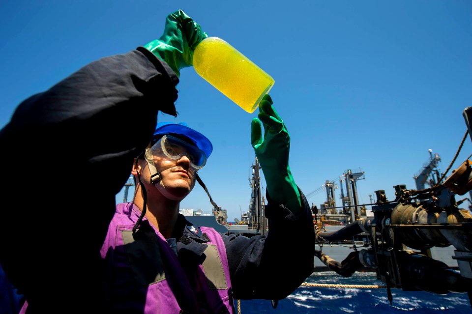 A Sailor conducts a fuel test aboard USS Ross. (17637297540)