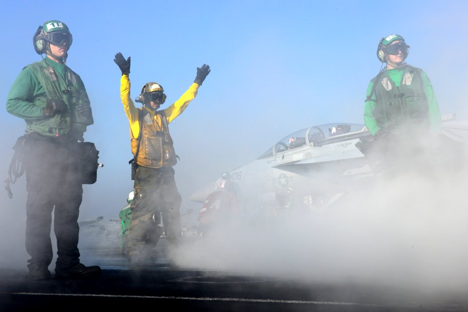 A Sailor directs aircraft aboard USS John C. Stennis. (8426059869)