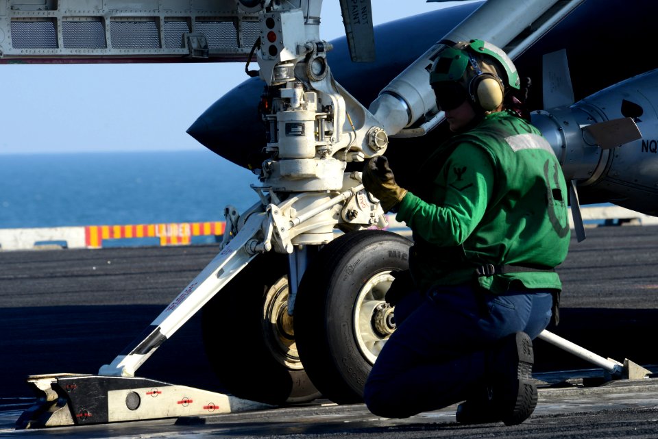 A Sailor directs an aircraft aboard USS John C. Stennis. (8339127706)