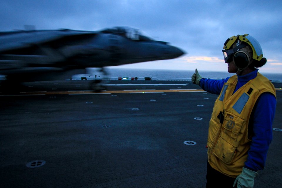 A Sailor directs an AV-8B aboard USS Boxer. (8597781248)