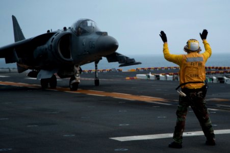 A Sailor directs an AV-8B aboard USS Boxer. (8596676589)