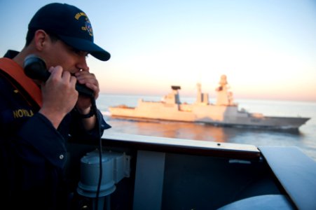 A Sailor aboard USS Mobile Bay alongside Chevalier Paul. (8471156570)