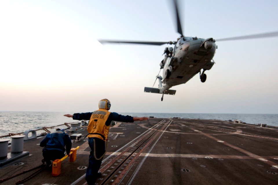 A Sailor directs an SH-60B aboard USS Winston S. Churchill. (8595820576)
