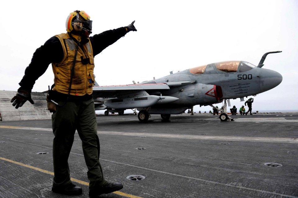 A Sailor directs an EA-6B Prowler. (8695598297)