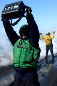 A Sailor displays an aircraft's weight. (8407483379)