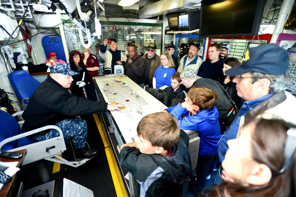 A Sailor gives a tour of flight deck control aboard USS Enterprise. (8240475457)