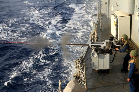 A Sailor fires a 25mm machine gun. (8230252174)