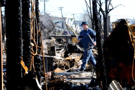 A Sailor helps clean Staten Island. (8185198205)