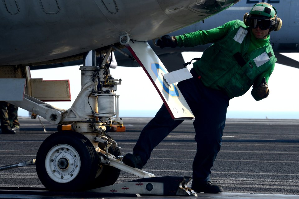 A Sailor directs an aircraft aboard USS John C. Stennis. (8456180008)