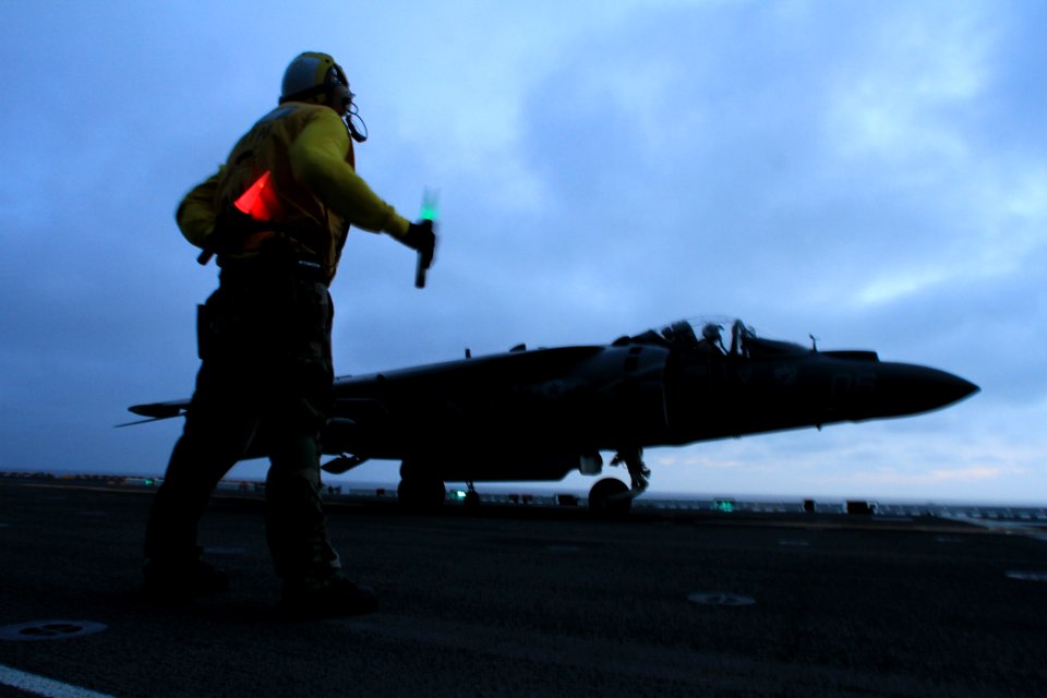 A Sailor directs an AV-8B aboard USS Boxer. (8597781318)