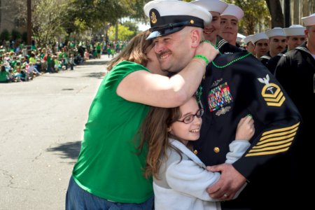 A Sailor hugs his family at a parade. (8574826532)