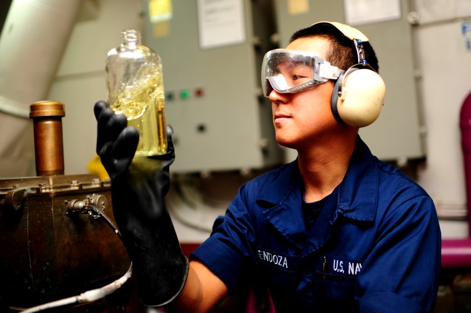 A Sailor inspects fuel aboard USS George H.W. Bush. (8446975123)