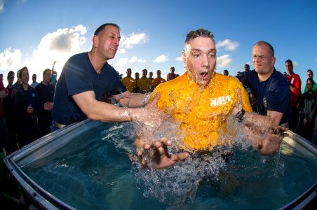 A Sailor is baptized aboard USS George Washington. (20238898396) photo