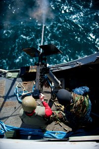A Sailor fires a .50-caliber machine gun. (6852044931)