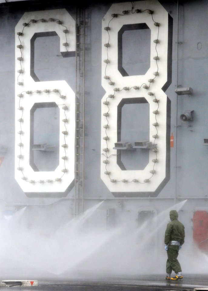 A Sailor participates in a flight deck washdown. (8200232506)
