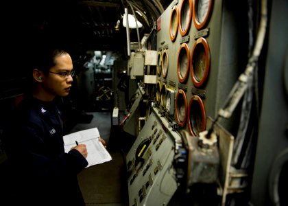 A Sailor monitors engines aboard USS Tortuga. (8435774954) photo