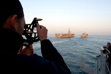 A Sailor measures distance at sea. (8357467583)