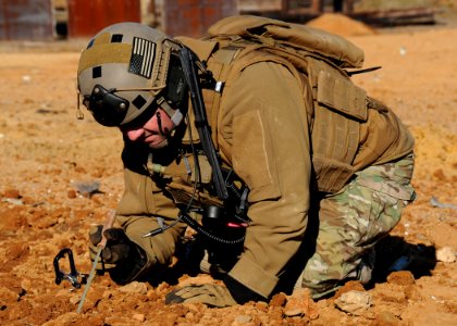 A Sailor practices inspecting a blast crater. (8497226399)