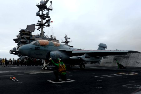 A Sailor gives the signal for an EA-6B Prowler to launch. (8695598701)