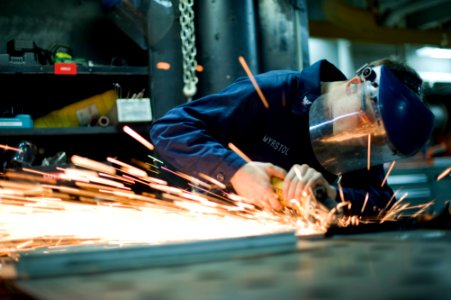 A Sailor grinds metal aboard USS John C. Stennis. (8471157288)