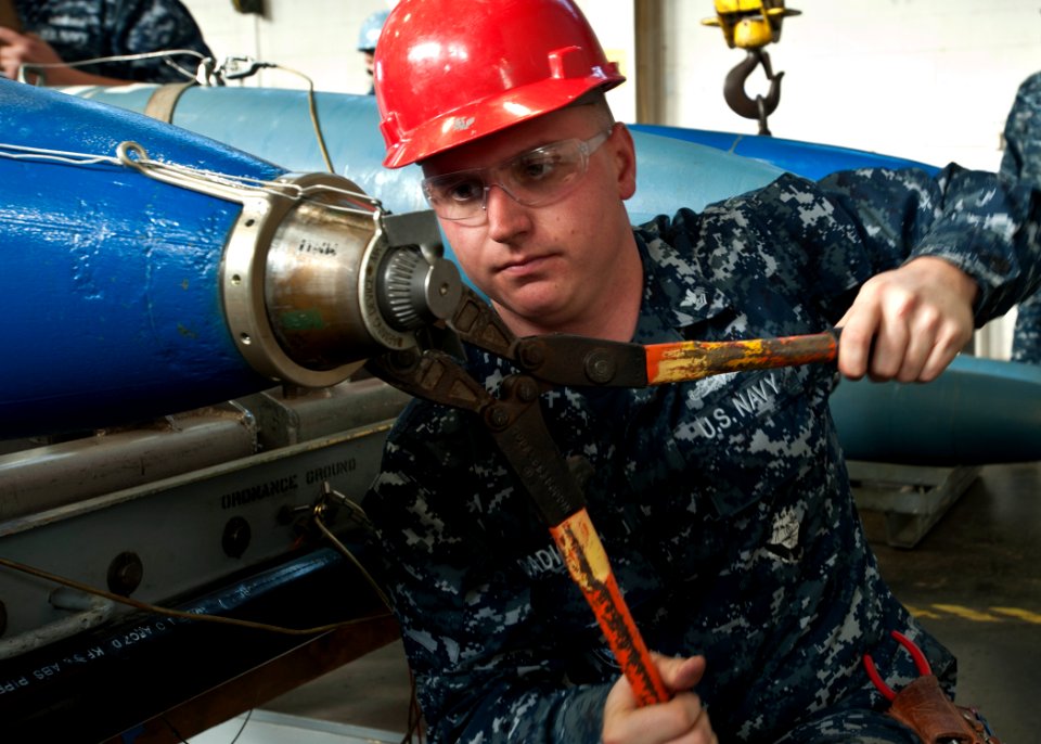 A Sailor practices arming a mine. (8408580174)