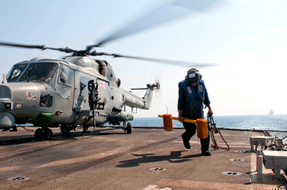 A Sailor removes chocks and chains. (8202178841)