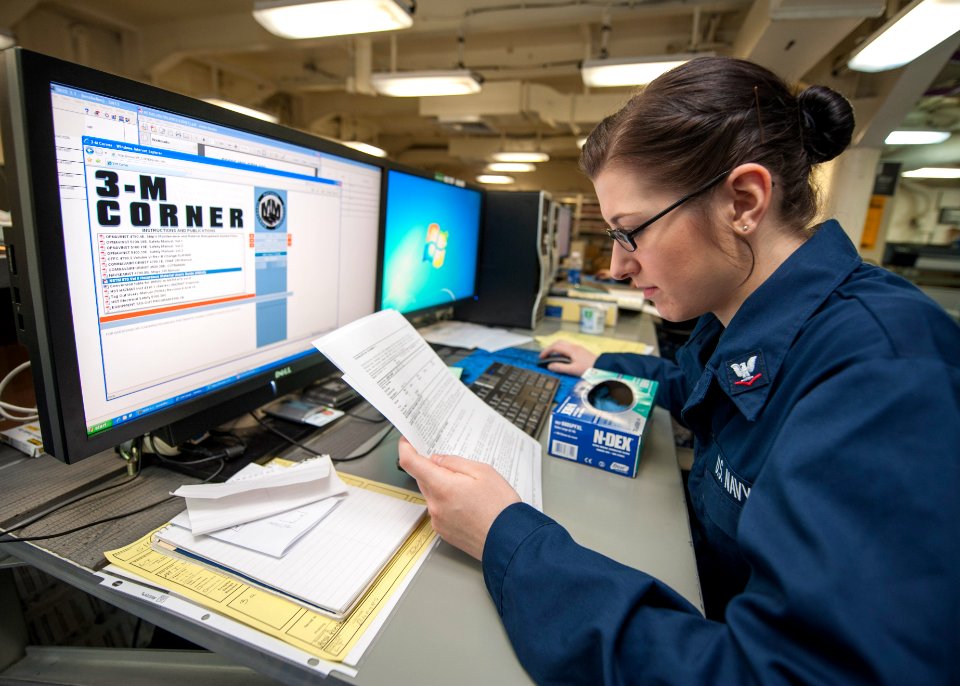 A Sailor reviews maintenance information at sea. (8413080911)