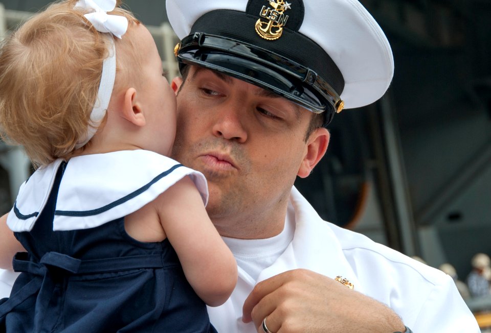A Sailor says goodbye to his daughter as the USS George Washington prepares to depart. (17638589769)