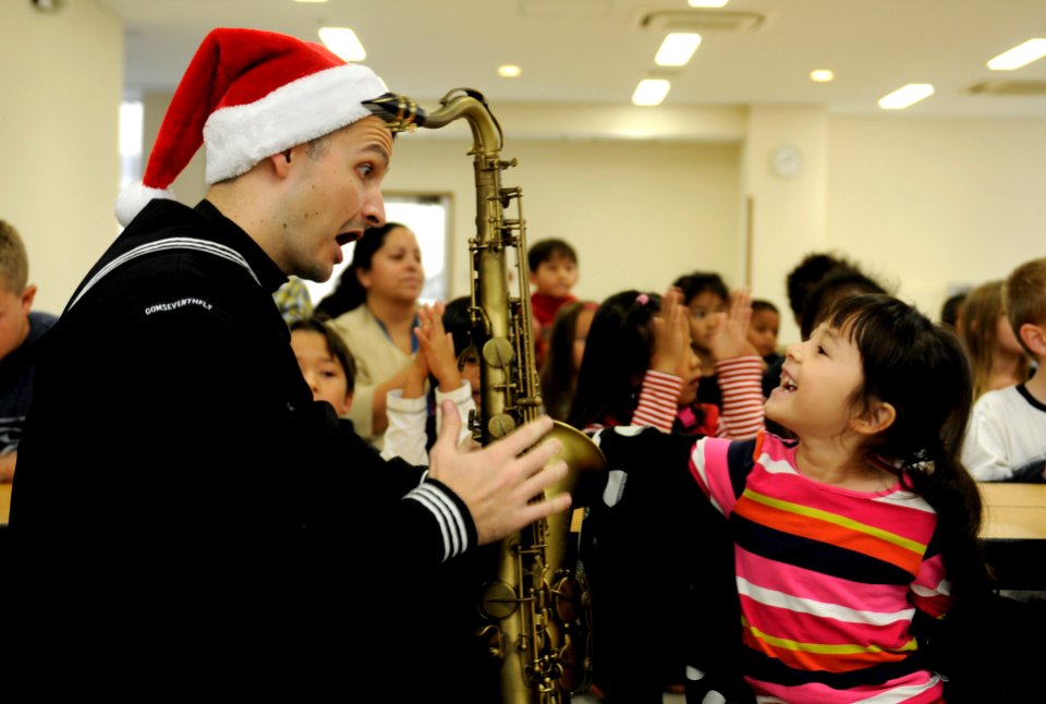 A Sailor shows off his saxophone. (8243543551)