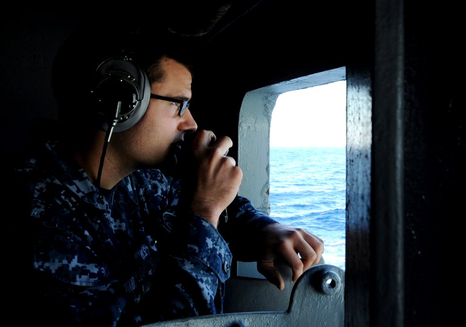 A Sailor stands lookout watch at sea. (8283346659)