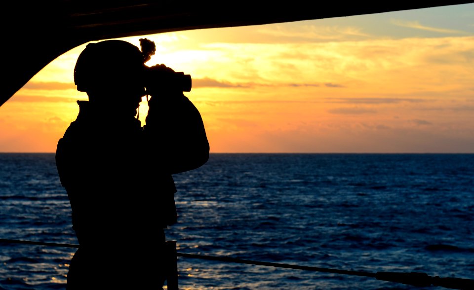 A Sailor stands lookout at sea. (8407485777)