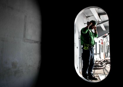 A Sailor prepares for flight deck duty. (22332453776)