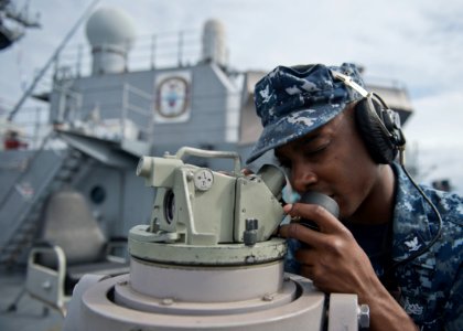 A Sailor reports range and bearing information. (8410211315)