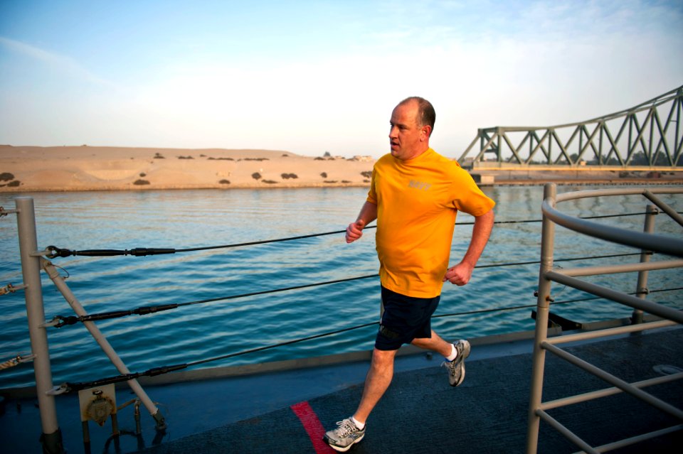 A Sailor runs aboard USS Hue City in the Suez Canal. (8574826394)