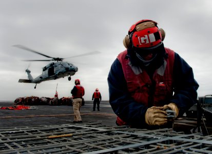 A Sailor secures a sling during an ordnance onload. (8497234375)