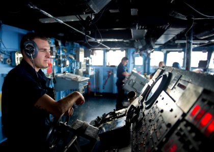 A Sailor steers USS Tortuga. (8455082729)