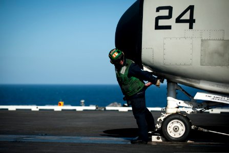 A Sailor takes tension on a C-2A at sea. (8475346341)