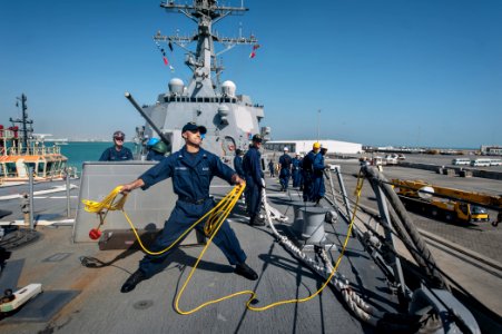 A Sailor throws a heaving line in Bahrain. (8580535276) photo