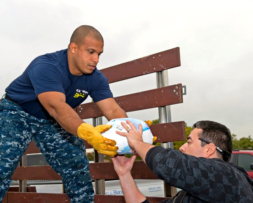 A Sailor unloads a donated turkey. (8200233882)