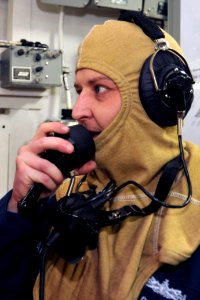 A Sailor uses a sound-powered phone during a drill. (8427154952)