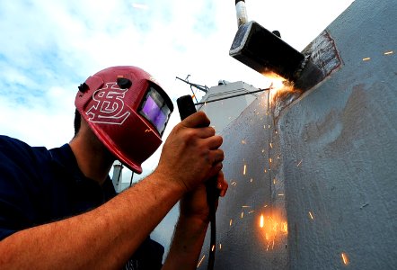 A Sailor welds a radar mount. (8202178523)