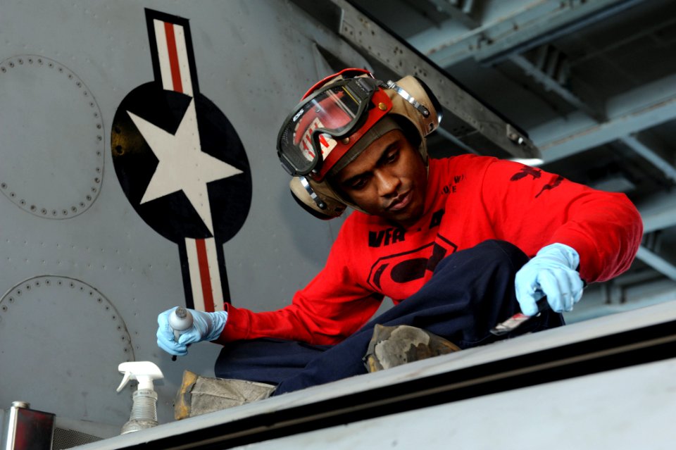 A Sailor works on an F-A-18 aboard USS John C. Stennis. (8498329846)