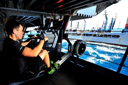 A Sailor works out during a replenishment-at-sea. (8476432862)