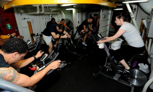 A Sailor teaches a spin class at sea. (8202180911) photo