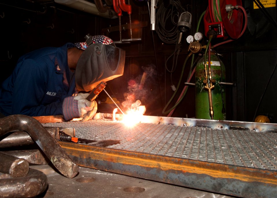 A Sailor welds a frame aboard USS Harry S. Truman. (8427153628)