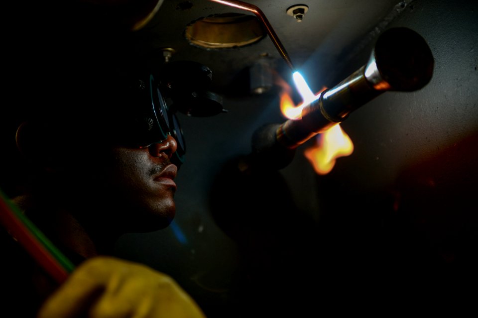 A Sailor welds aboard USS Theodore Roosevelt . (16590670584)