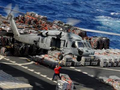 A Sea Hawk helicopter resupplies USS Nimitz. (8695664007)