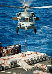 A Sea Hawk helicopter takes supplies to USS Nimitz. (8696788134)